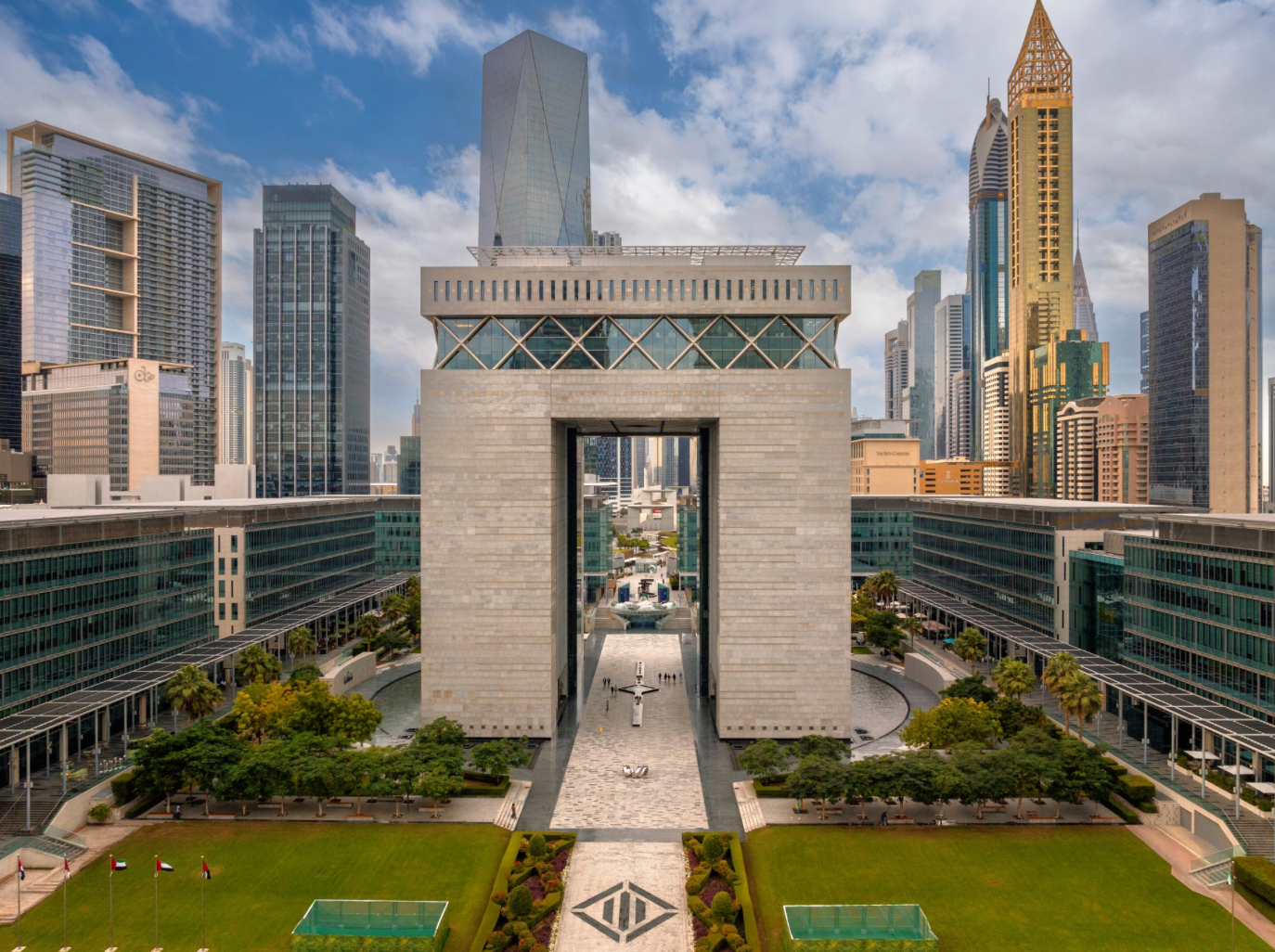 Dubai International Financial Centre (DIFC) framed by Dubai’s modern skyline and landmark skyscrapers under a bright sky