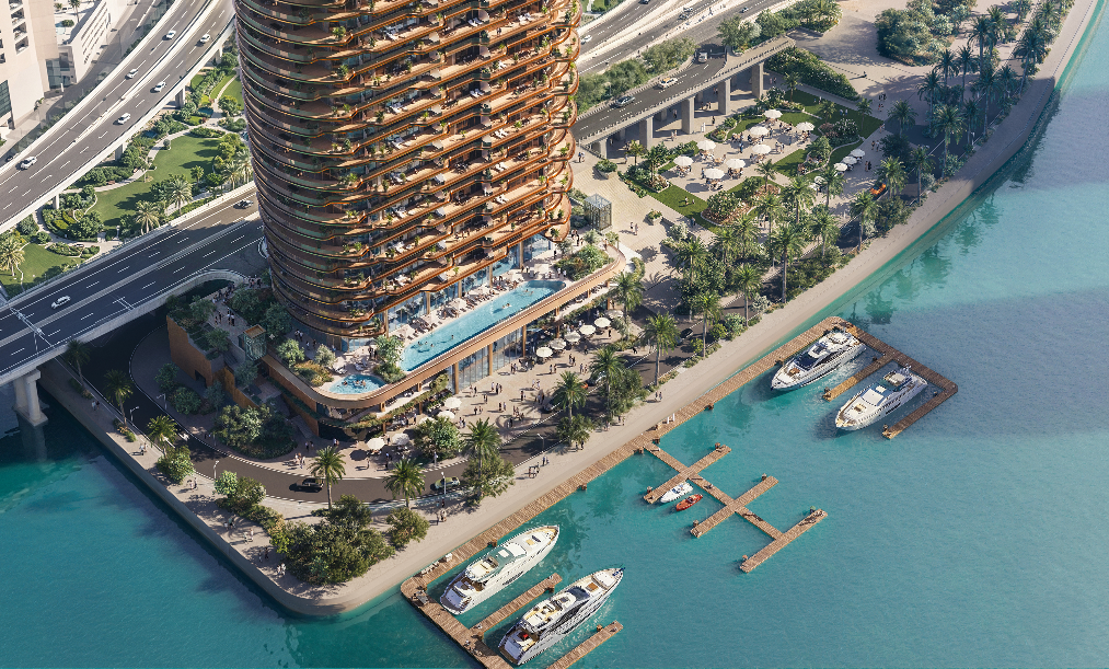 Aerial view of Jumeirah Residencies Al Maryah Island overlooking the waterfront marina and Abu Dhabi skyline.