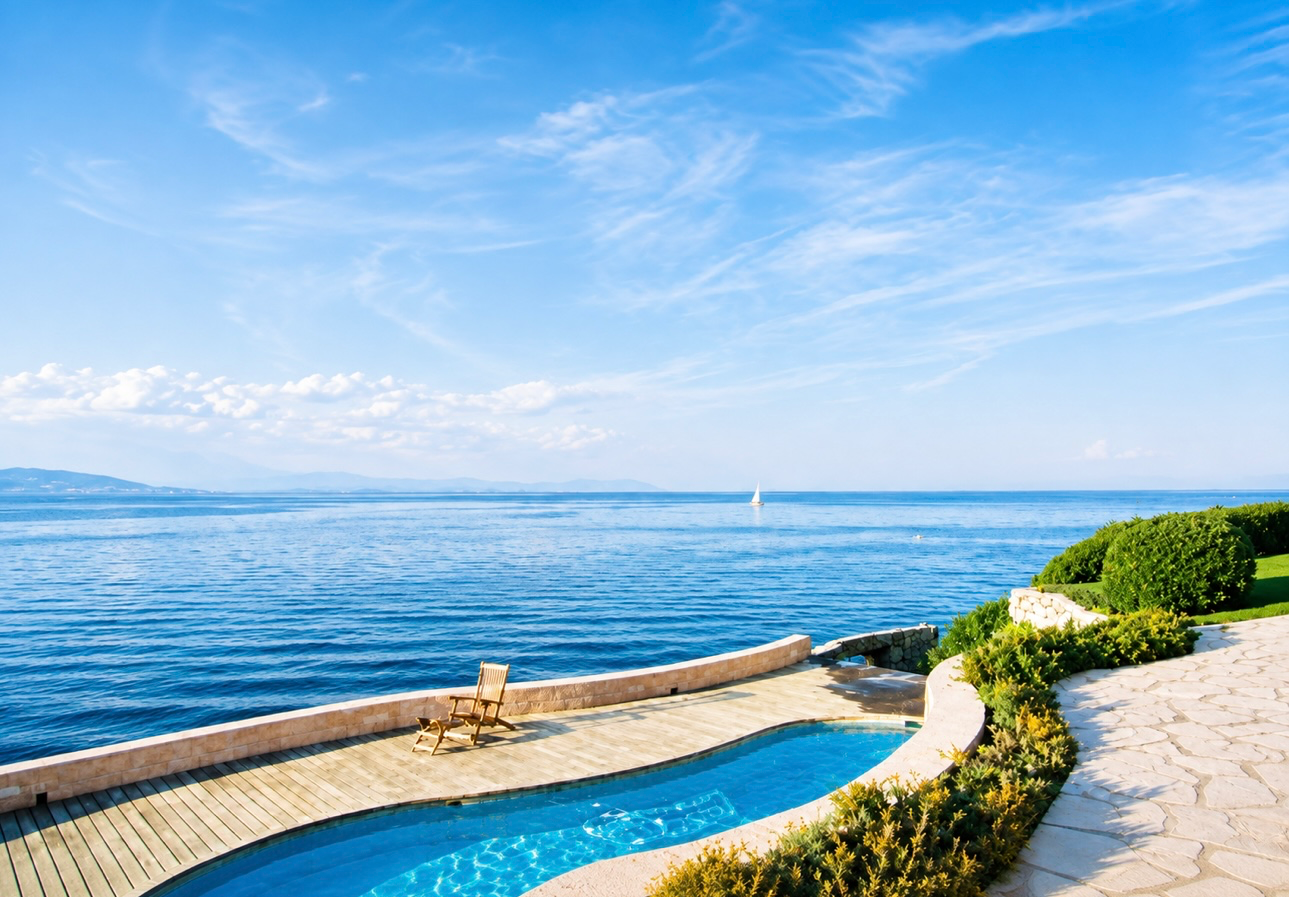 Outdoor pool with panoramic Mediterranean water views at Villa Marine in Saint-Tropez
