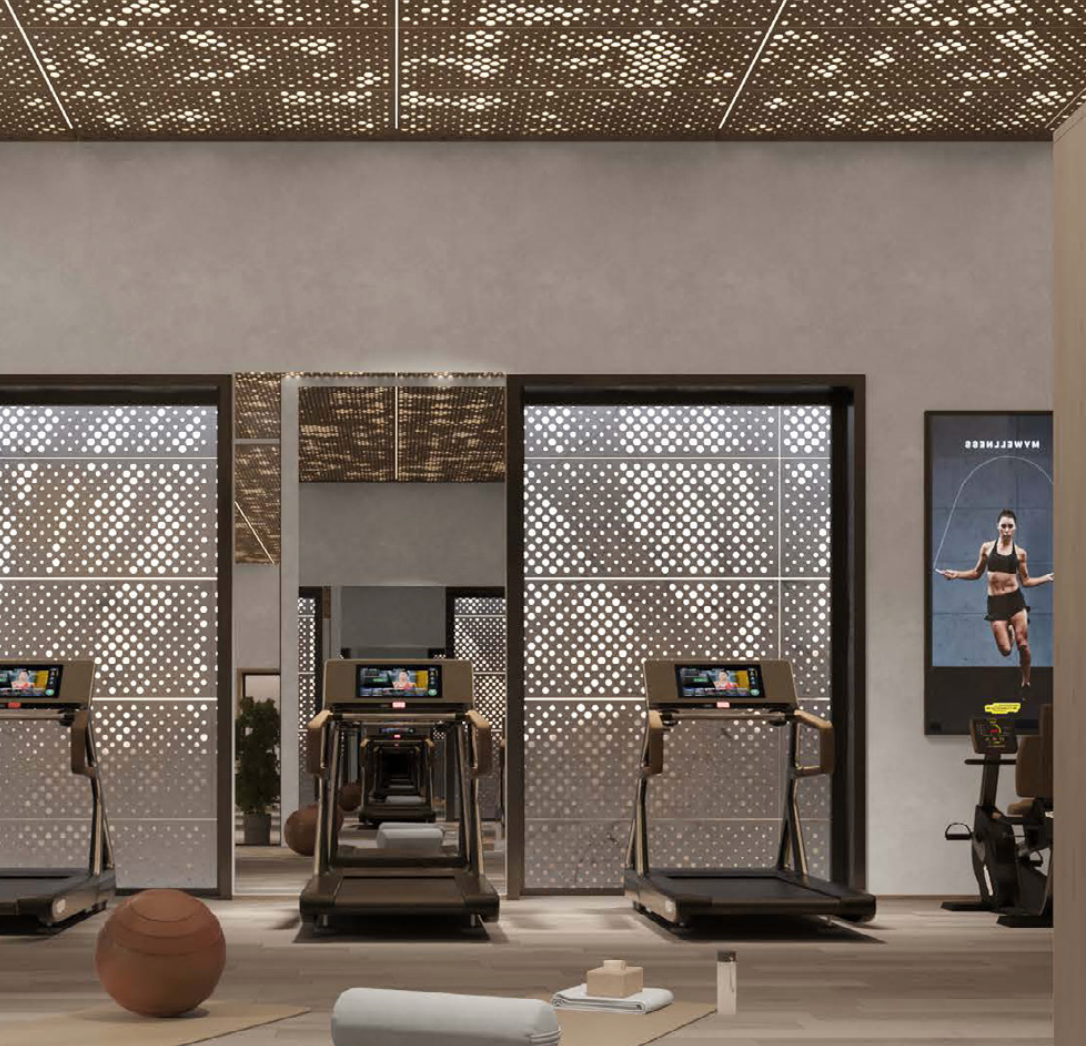 Premium fitness and wellness facility at AHS Tower overlooking the Dubai skyline.