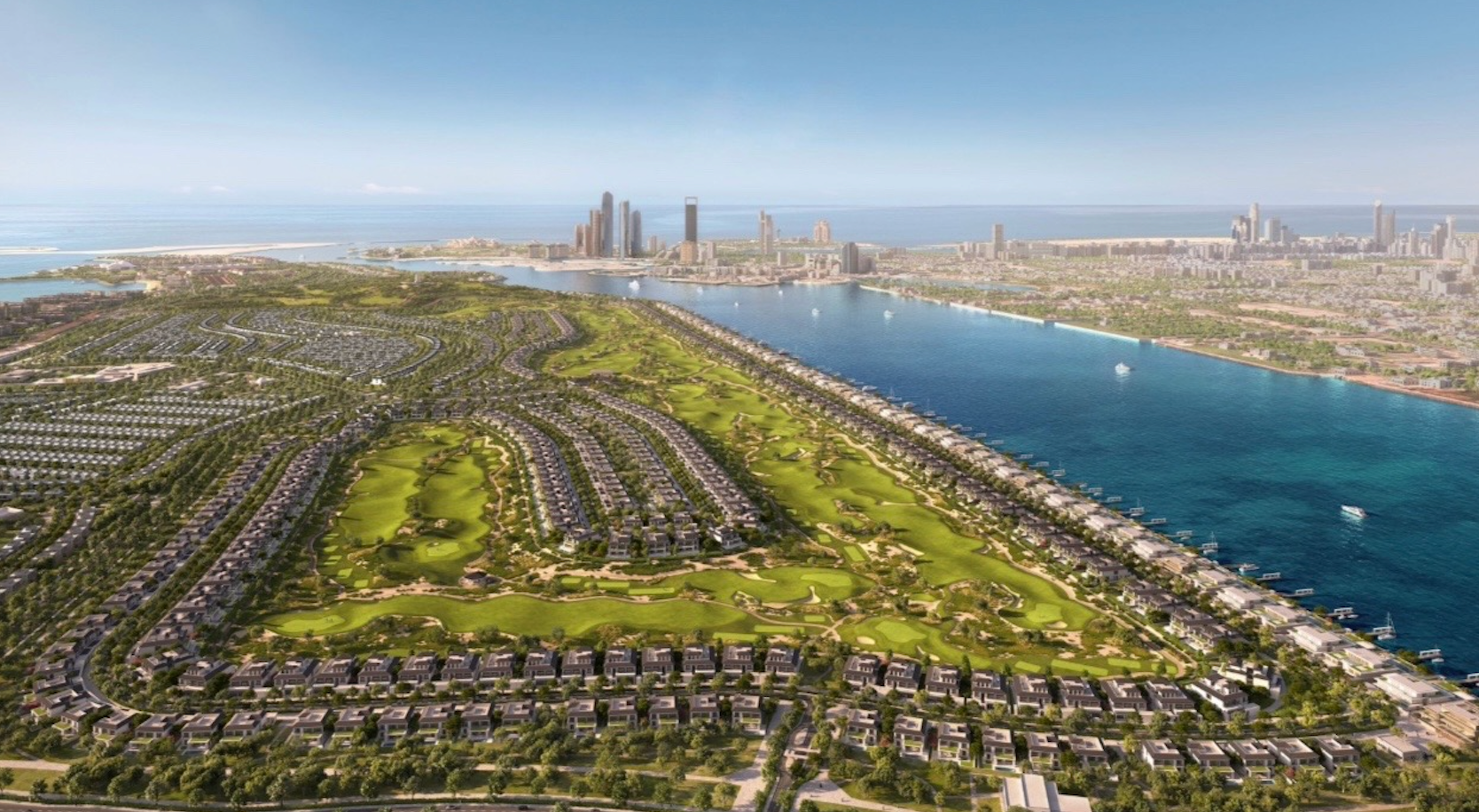 Aerial view of Hudayriyat Golf Estates with fairways, villas and Abu Dhabi skyline.