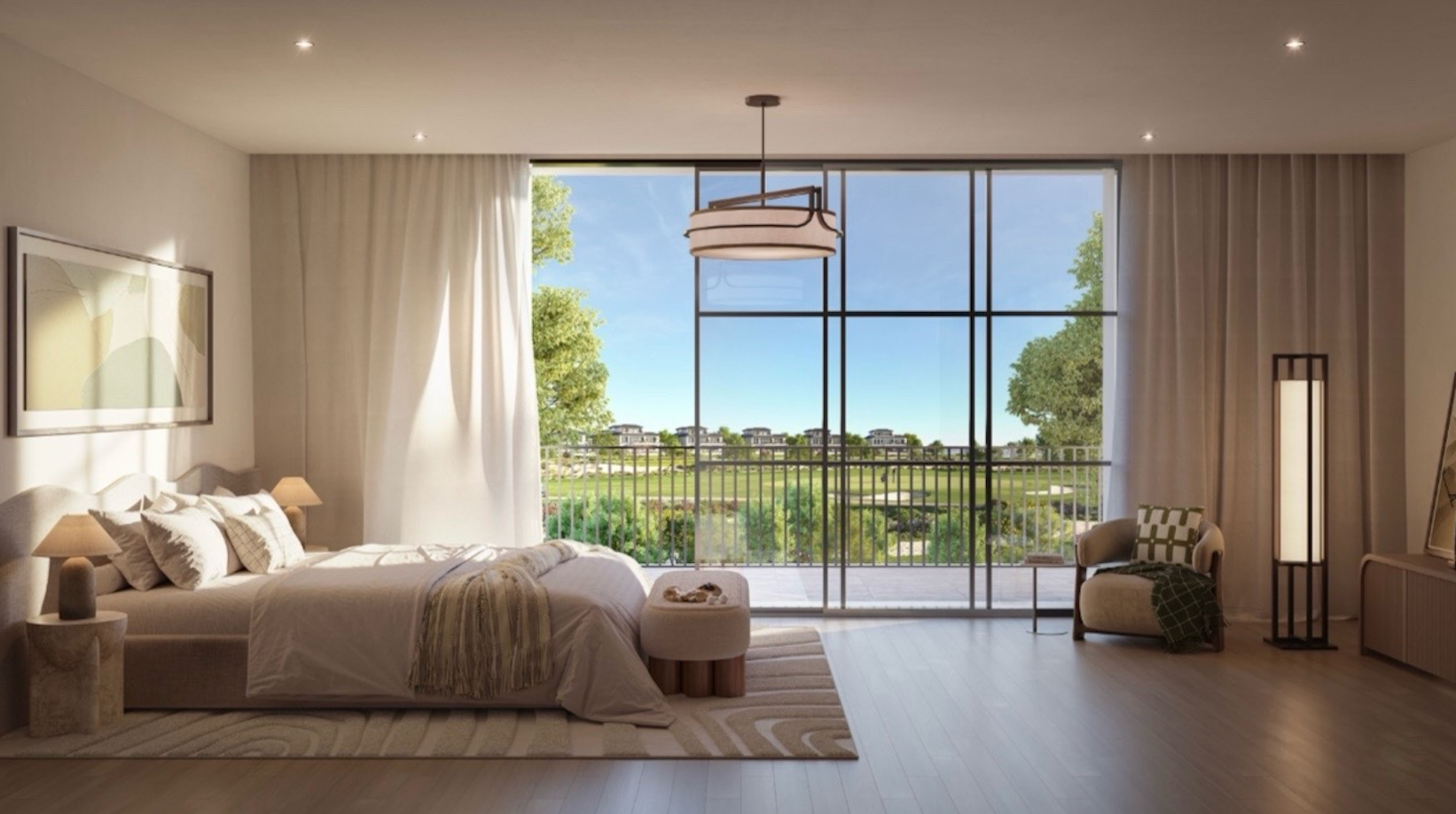 Primary bedroom suite with golf course views at Hudayriyat Golf Estates.