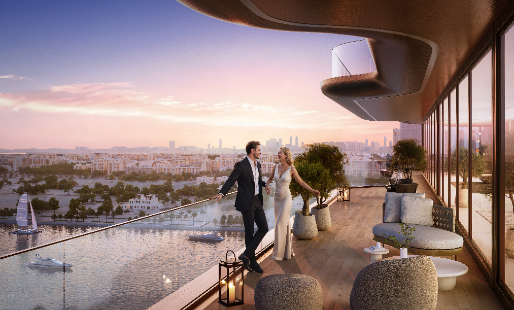 Couple relaxing on a private waterfront terrace at Jumeirah Residences Al Maryah Island overlooking the marina.