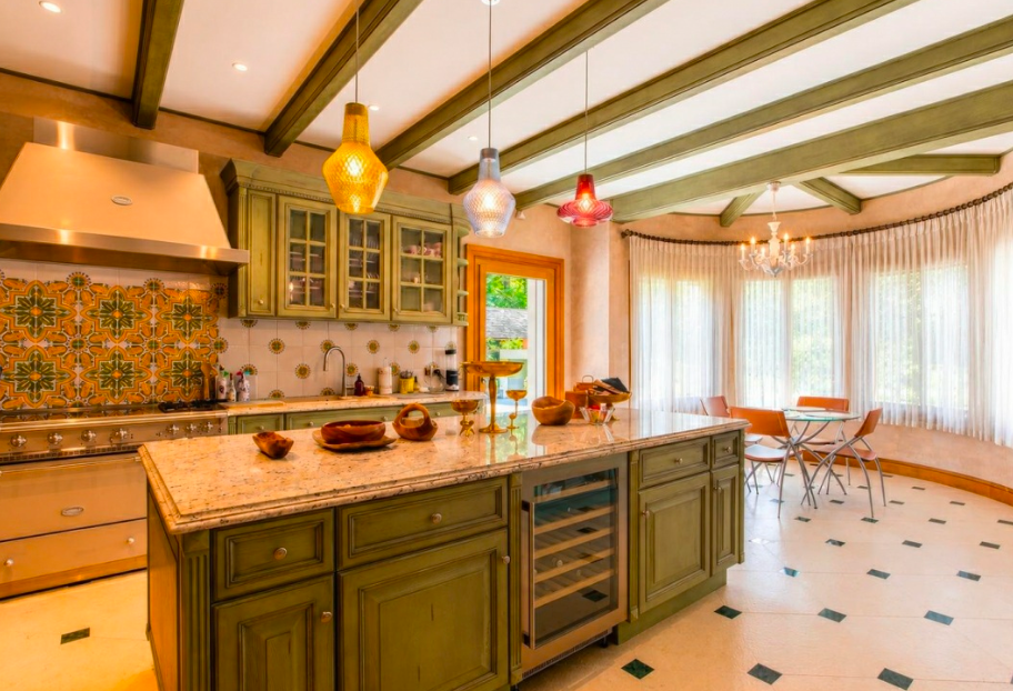 Contemporary open-plan kitchen with premium finishes, high ceilings and seamless indoor-outdoor living.