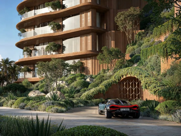 Jumeirah Asora Bay waterfront residences surrounded by landscaped hillside greenery in Dubai.
