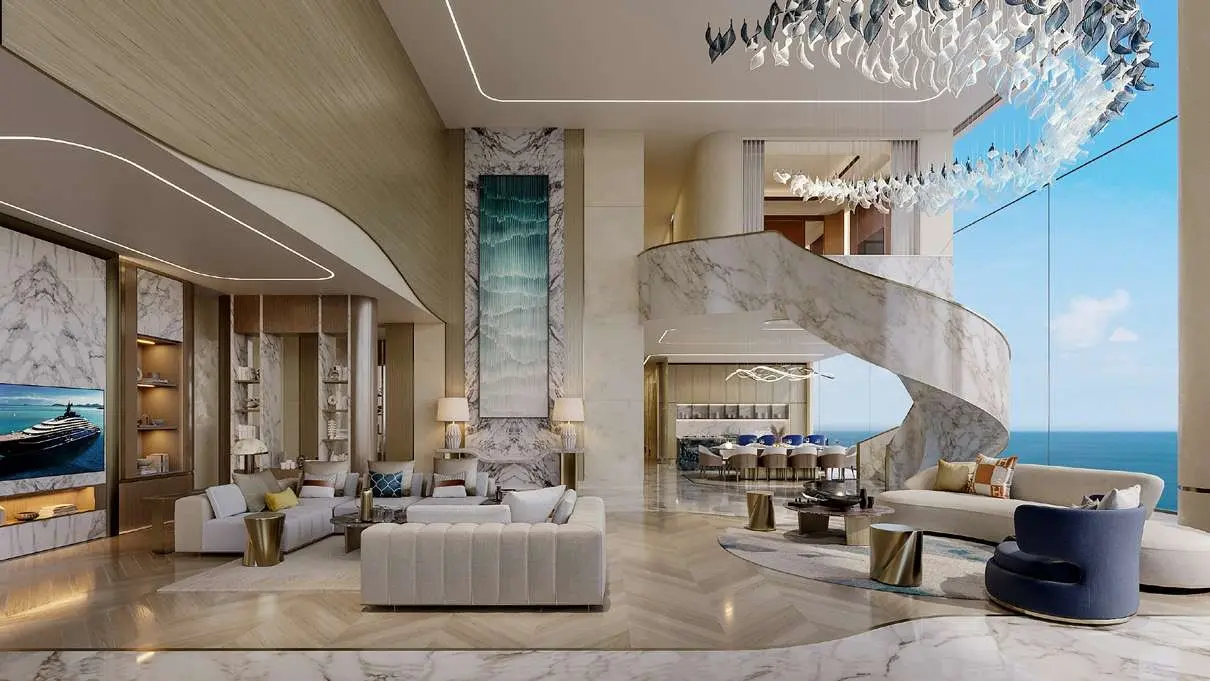 Open-plan luxury living room with panoramic waterfront views at One Crescent Palm.